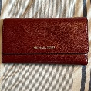 Red Michael Kors trifold wallet